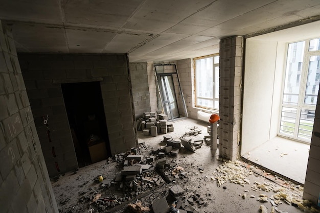 Abandoned house interior, dirty room, rotten peeled walls.