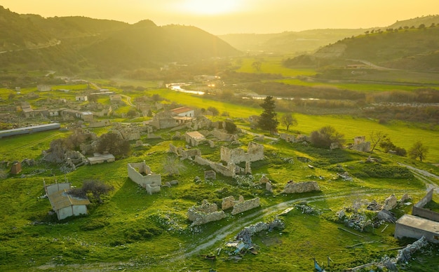 Abandoned village Souskiou in Paphos district Cyprus Aerial landscape at sunset