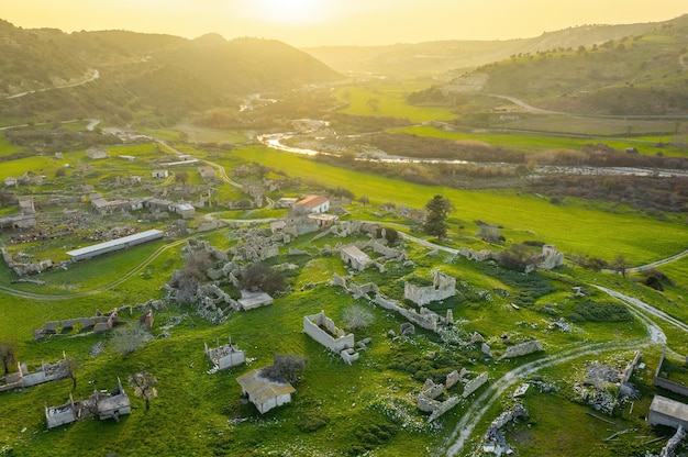 Abandoned village Souskiou in Paphos district Cyprus Aerial panorama at sunset