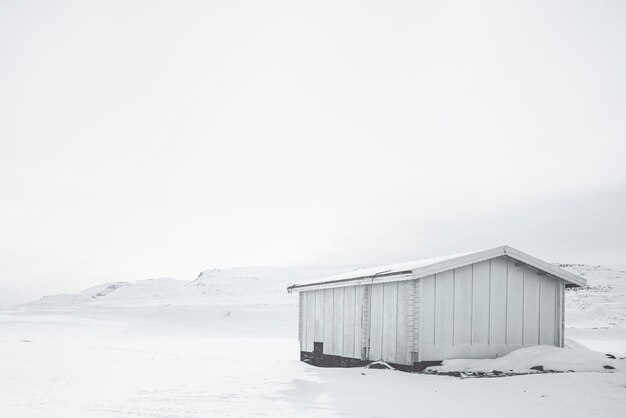 Abandoned wooden cabin winter background