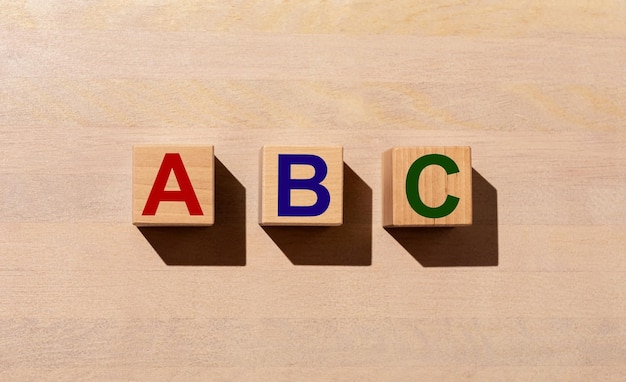 ABC letters on cubes Start begin concept alphabet on wood table