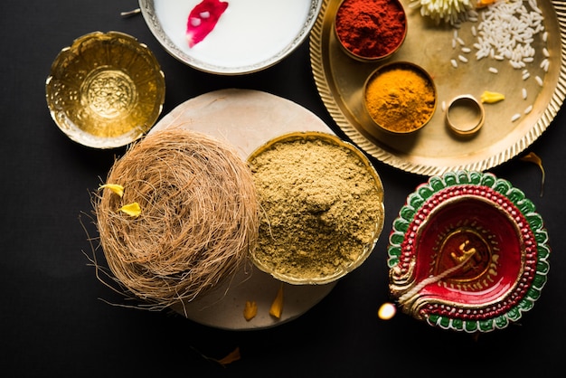 Abhyanga Snan OR Special Herbal Bath on Diwali with Ubtan or Utne and Scrub over moody surface, selective focus