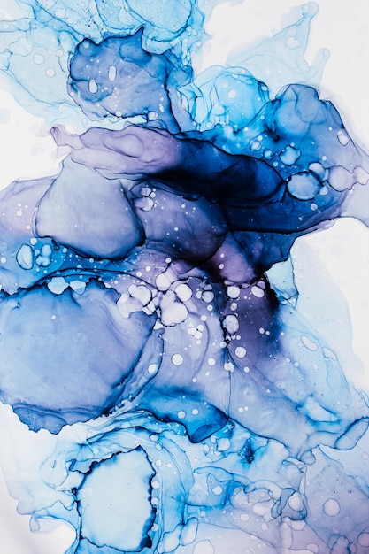 Abstract alcohol ink background in blue azure tones with