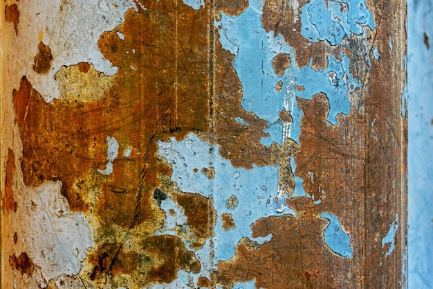 Abstract art wallpaper from rusty metal with blue background