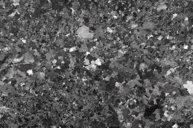 Abstract background of black granite texture. High resolution photo.