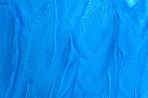 Abstract background blue surface of dried paint. Textured, close-up