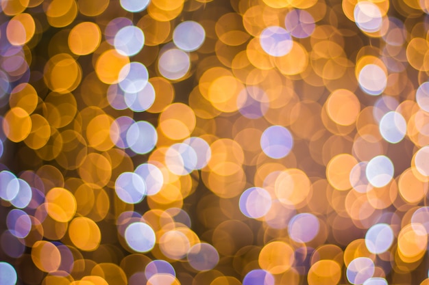 Abstract background bokeh of sparkling golden lights