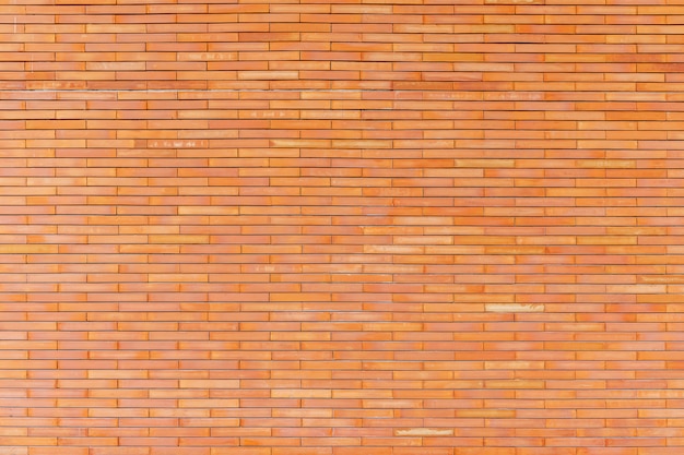 Abstract background from brown brick pattern on wall.