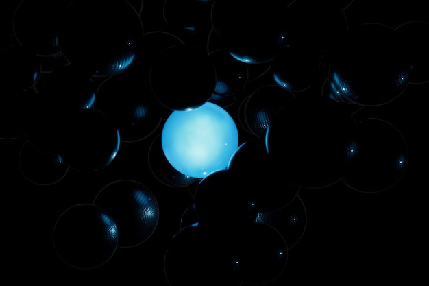 abstract background. glowing blue neon balls in a black shapeless mass.