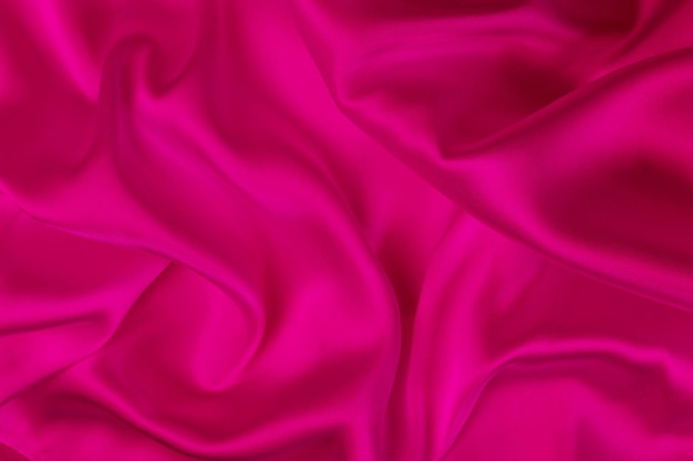 Abstract background luxury cloth or liquid wave or wavy folds of grunge silk texture satin material or luxurious