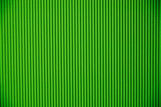 Abstract background made of corrugated paper for green application Space for text Texture Vertical stripes