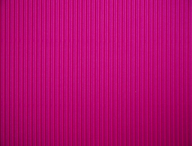 Abstract background made of corrugated paper for pink application Space for text Texture Vertical stripes