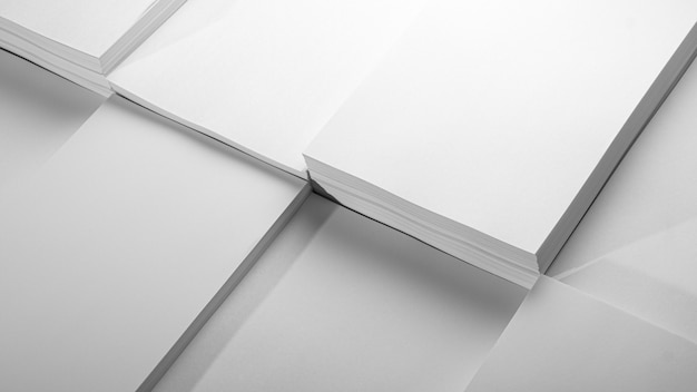 Abstract background, minimalism. Several stacks of white paper for photocopier, on a white background. Office work concept.