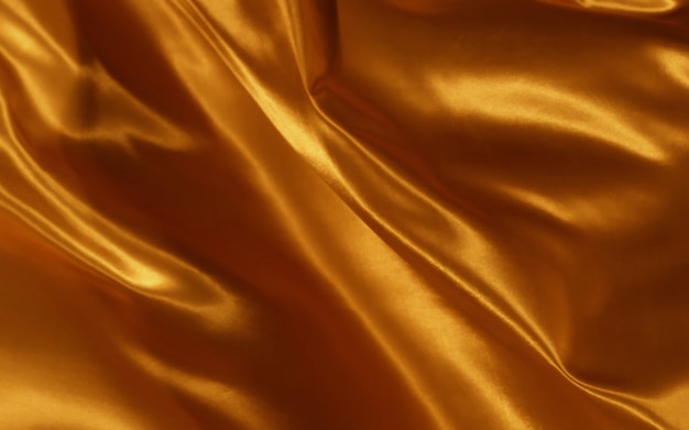 Abstract background orange silk or satin fabric texture