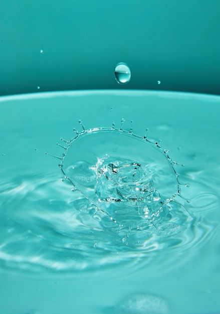 Abstract background of splash of color water, collision of colored drops, the concept art with abstract effect.