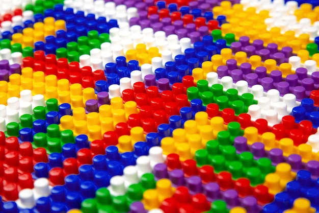 Abstract background texture of colored constructor blocks Background of colorful plastic part of constructor Pile of colored toy bricks