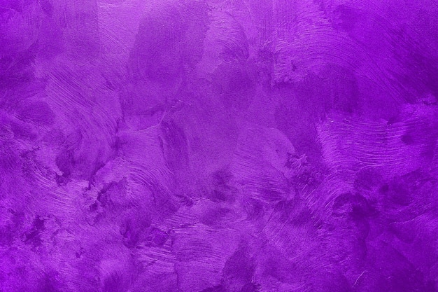 Abstract background of textured wall of purple color