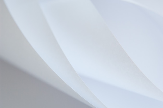 Abstract background of a twisted sheet of white paper