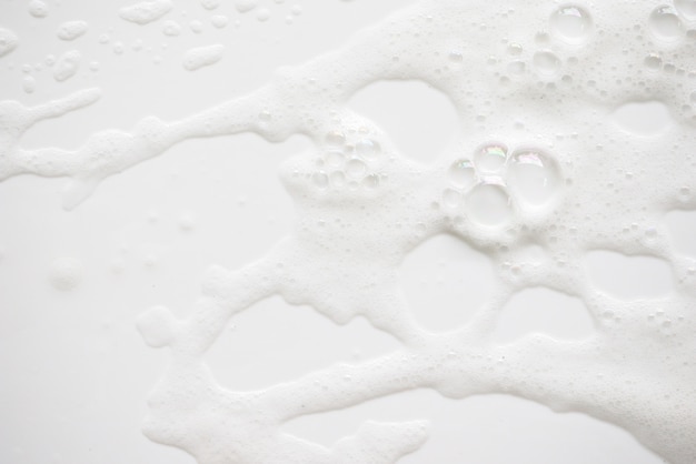 Abstract background white soapy foam texture. Shampoo foam with bubbles