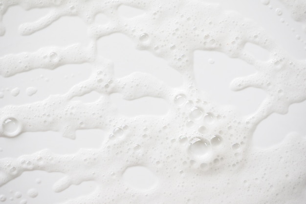 Abstract background white soapy foam texture. Shampoo foam with bubbles