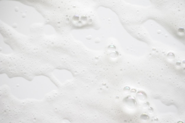 Abstract background white soapy foam texture. Shampoo foam with bubbles