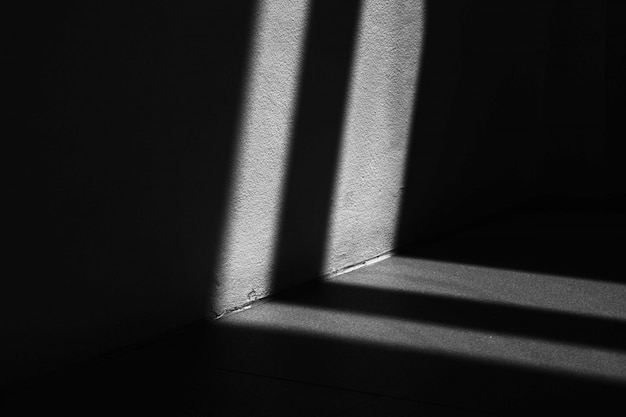 Photo abstract background of a white wall with shadows from the window