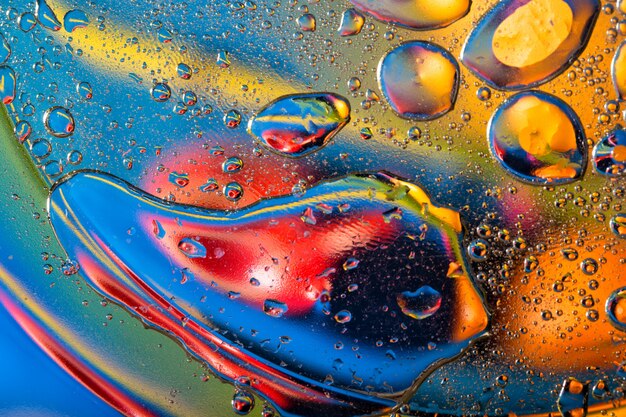 Abstract background with big and small oily drops