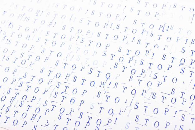 Abstract background with blue letters. Word stop