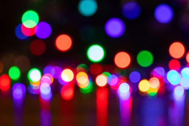 Abstract background with colorful sparkling bokeh on a dark background Holiday concept