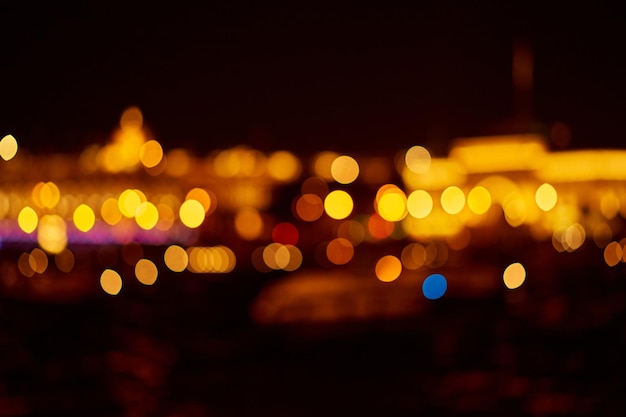 Abstract background with yellow defocused lights with bokeh at night