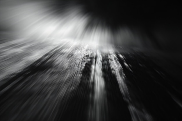 Abstract black and white background with motion blur and zoom effect