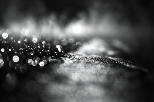 Abstract black and white bokeh background defocused lights