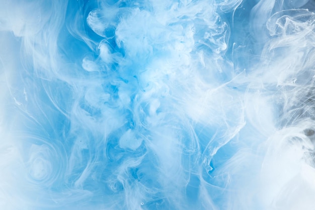 Abstract blue clear sky background with white soft clouds of smoke lightness and weightlessness watercolor pattern