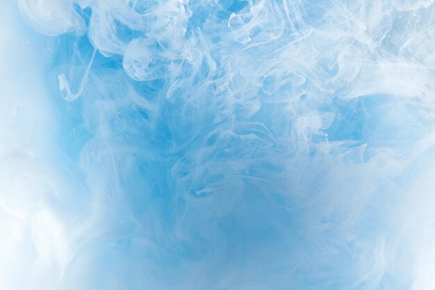 Abstract blue clear sky background with white soft clouds of smoke lightness and weightlessness watercolor pattern