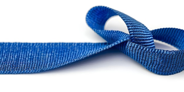 An abstract blue ribbon symbolizes awareness for various social causes and issues Concept Social awareness Ribbon symbol Blue color Abstract design