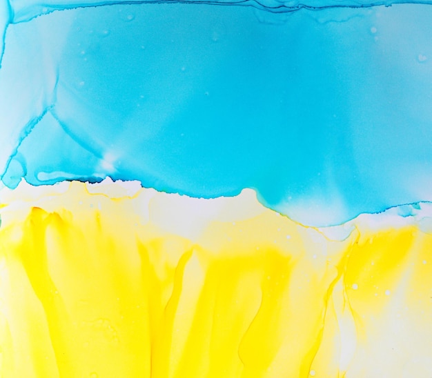 Abstract blue and yellow fragment of colorful background wallpaper Mixing acrylic paints Modern