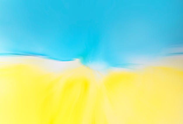 Abstract blue and yellow fragment of colorful background wallpaper Mixing acrylic paints Modern