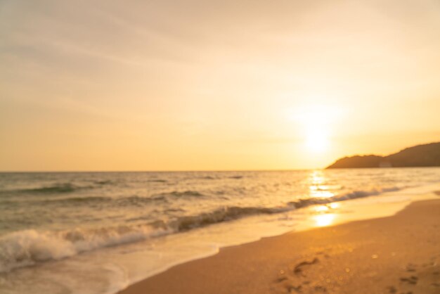 Abstract blur beautiful sea beach with sunset time for background