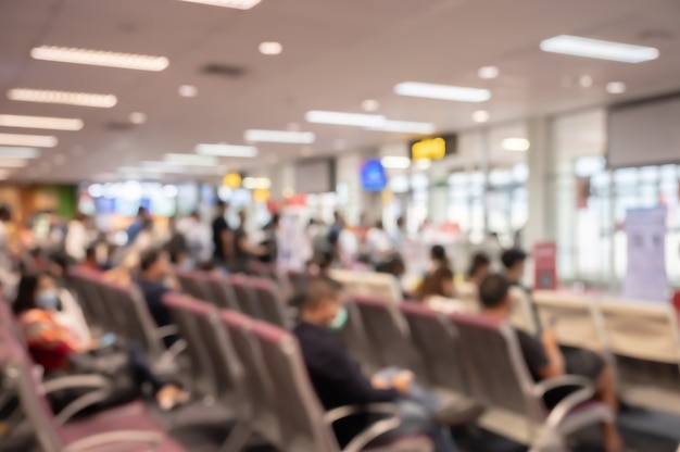 Abstract blur and defocused airport terminal interior with travelers