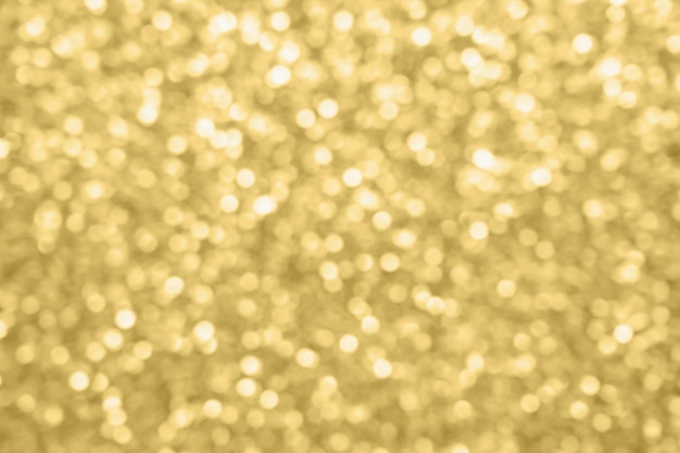 Abstract blur gold glitter sparkle defocused bokeh light background