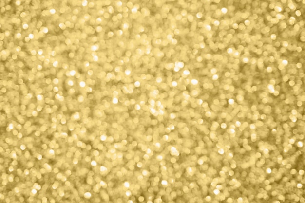 Abstract blur gold glitter sparkle defocused bokeh light background