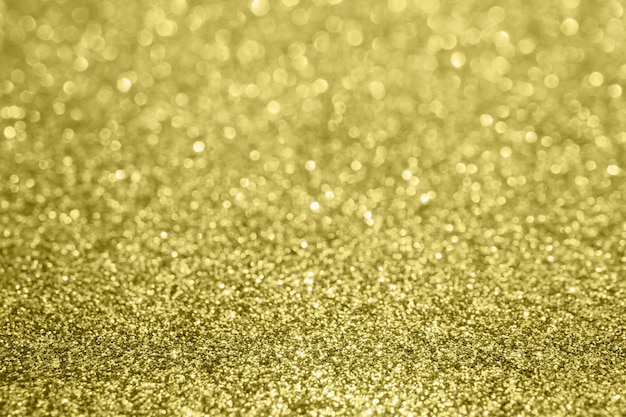 Abstract blur gold glitter sparkle defocused bokeh light background