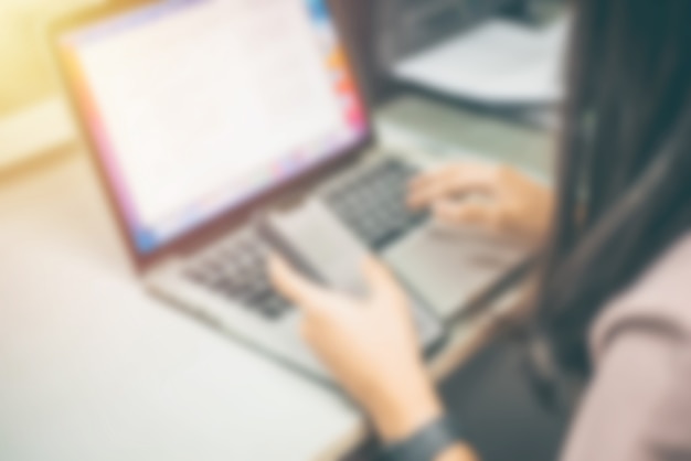 Abstract blur , officer working on computer at office building