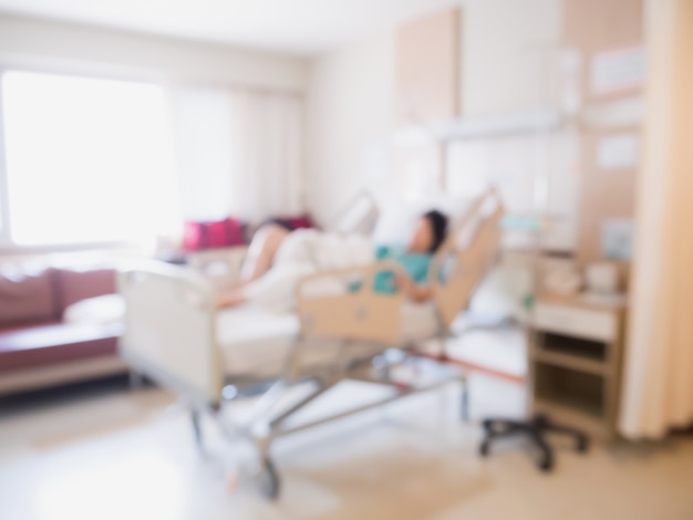 Abstract blur Patient on bed in Hospital Room interior for