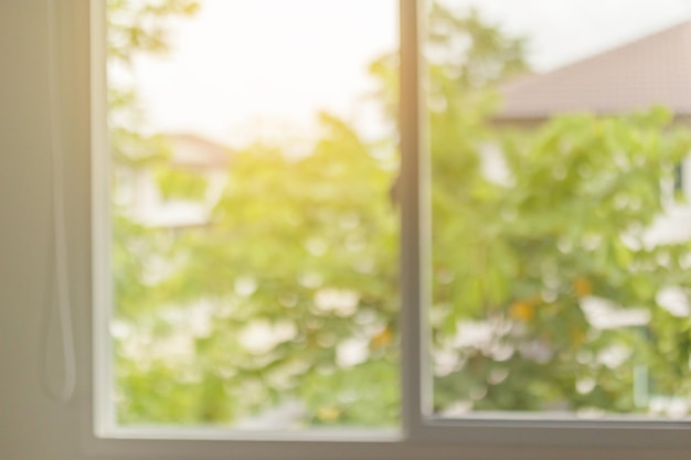 Abstract blur window interior with green garden view background