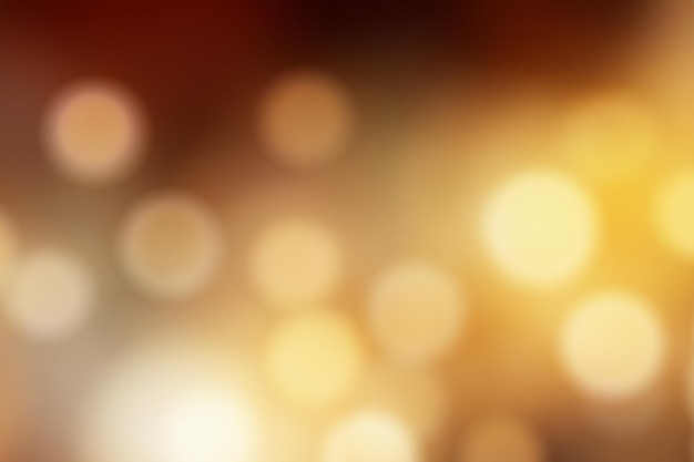 Abstract blurred background with golden and brown bokeh lights