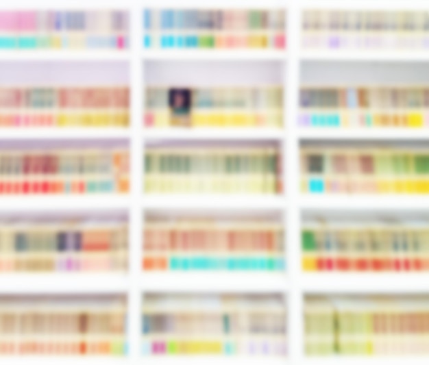 Abstract blurred background with shelves of books in a store or library