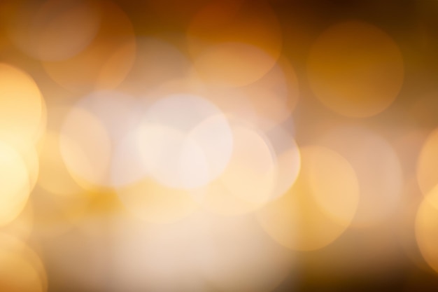 Abstract blurred background with warm golden bokeh lights