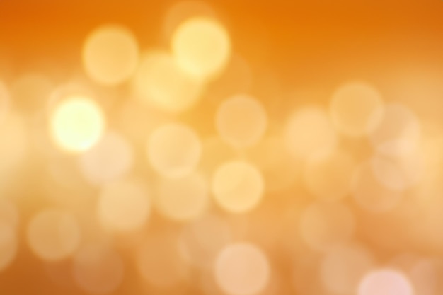 Abstract blurred background with yellow and orange bokeh lights