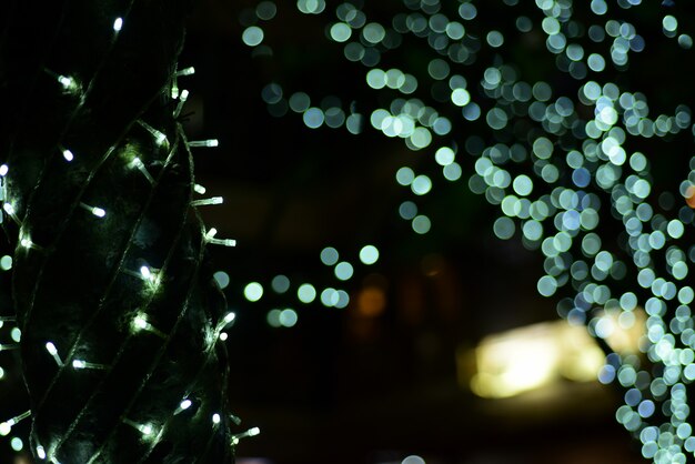 abstract blurred of blue and silver glittering shine bulbs lights background